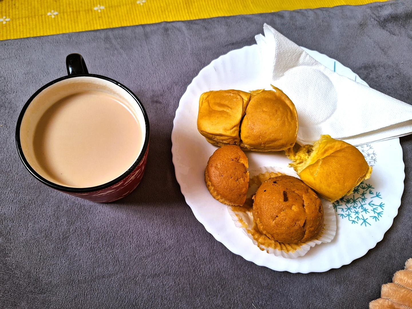 A cup of Kenyan tea with pastries